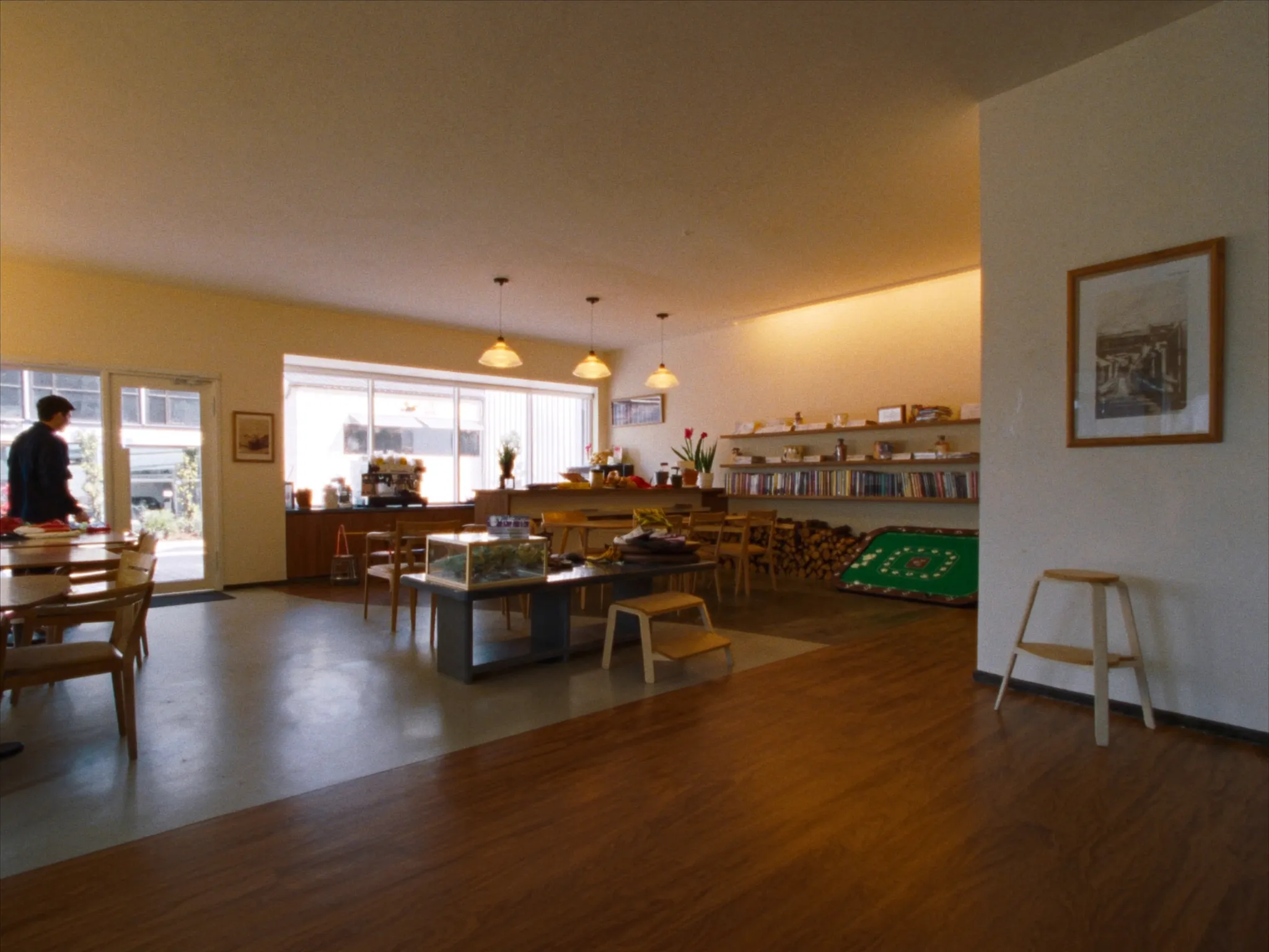 Tidy small commercial cafe interior with timber tables